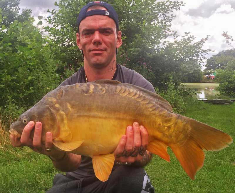 A photo of George with an 9 lb 12 oz Mirror Carp
