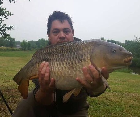 A photo of Ian at Elton Carp Lakes with a 21lb common carp